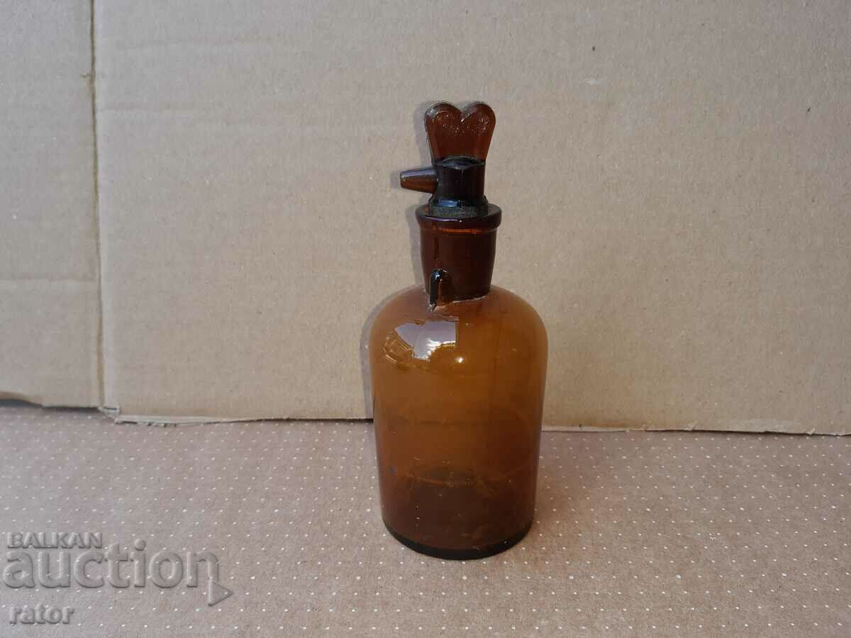 Old apothecary bottle with dropper. Pharmacy glassware