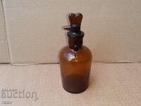 Old apothecary bottle with dropper. Pharmacy glassware