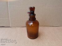 Old apothecary bottle with dropper. Pharmacy glassware