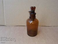 Old apothecary bottle with dropper. Pharmacy glassware