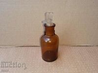 Old apothecary bottle with dropper. Pharmacy glassware