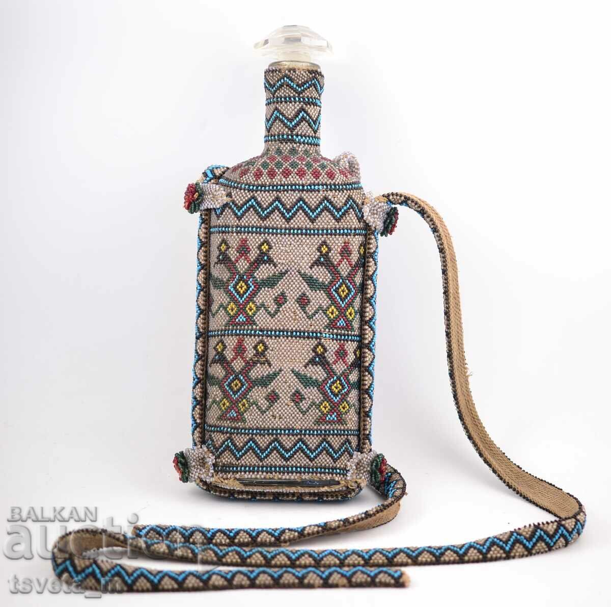 Glass bottle encrusted with glass beads, late 19th century