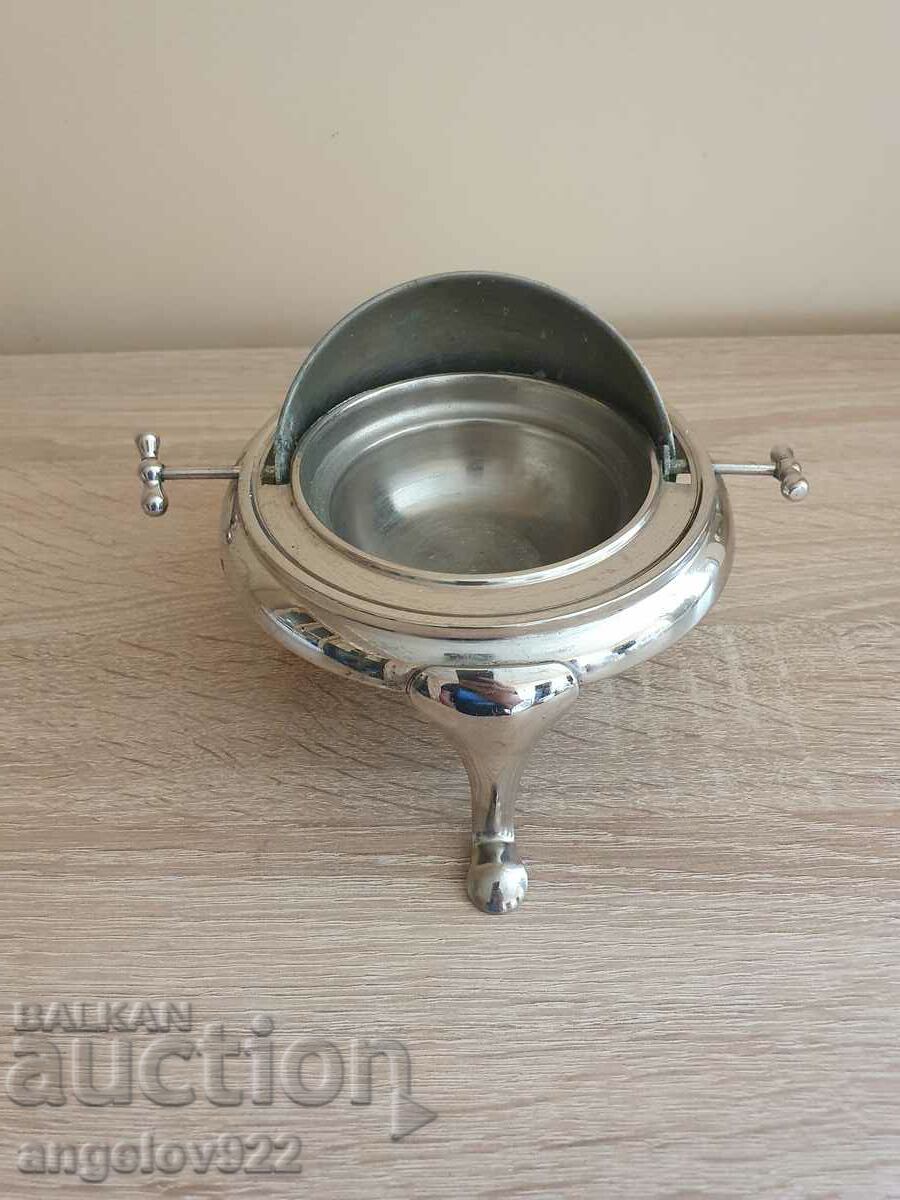 An interesting metal container with a closing lid
