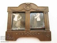 Old small metal double photo frame with ornaments