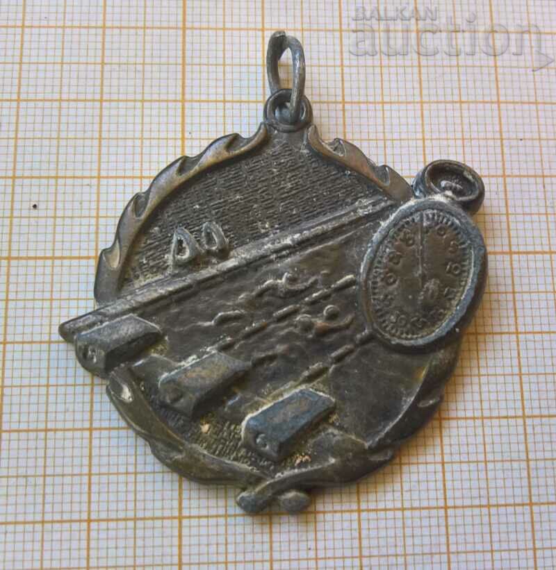 Old swimming medal