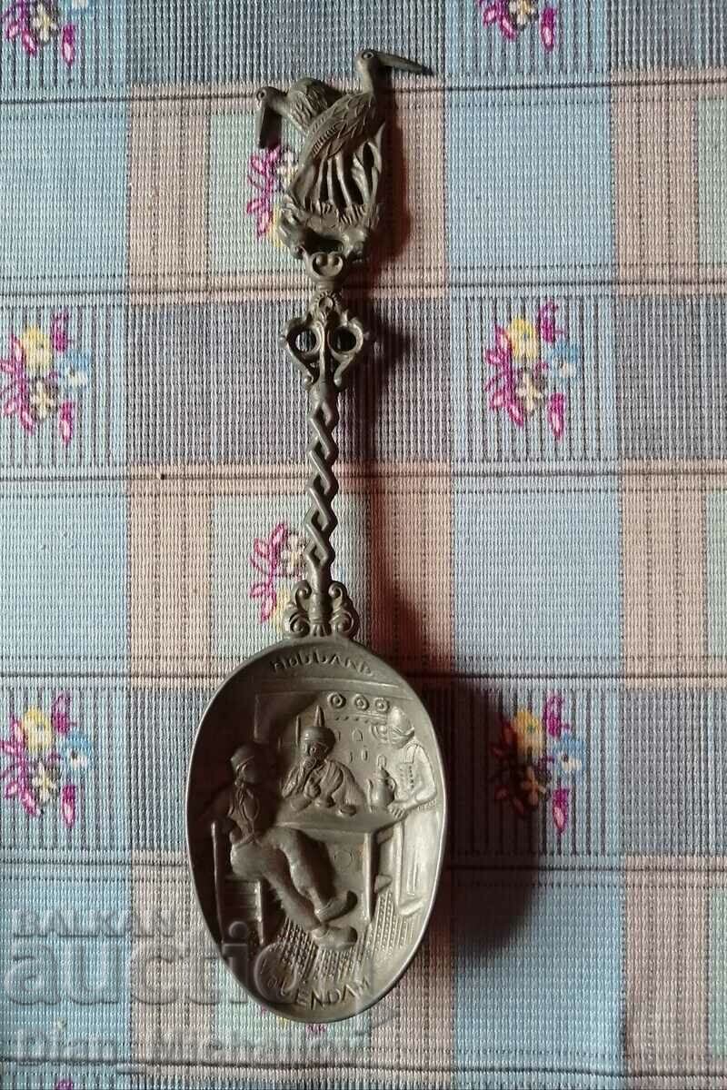 Antique decorative pewter spoon