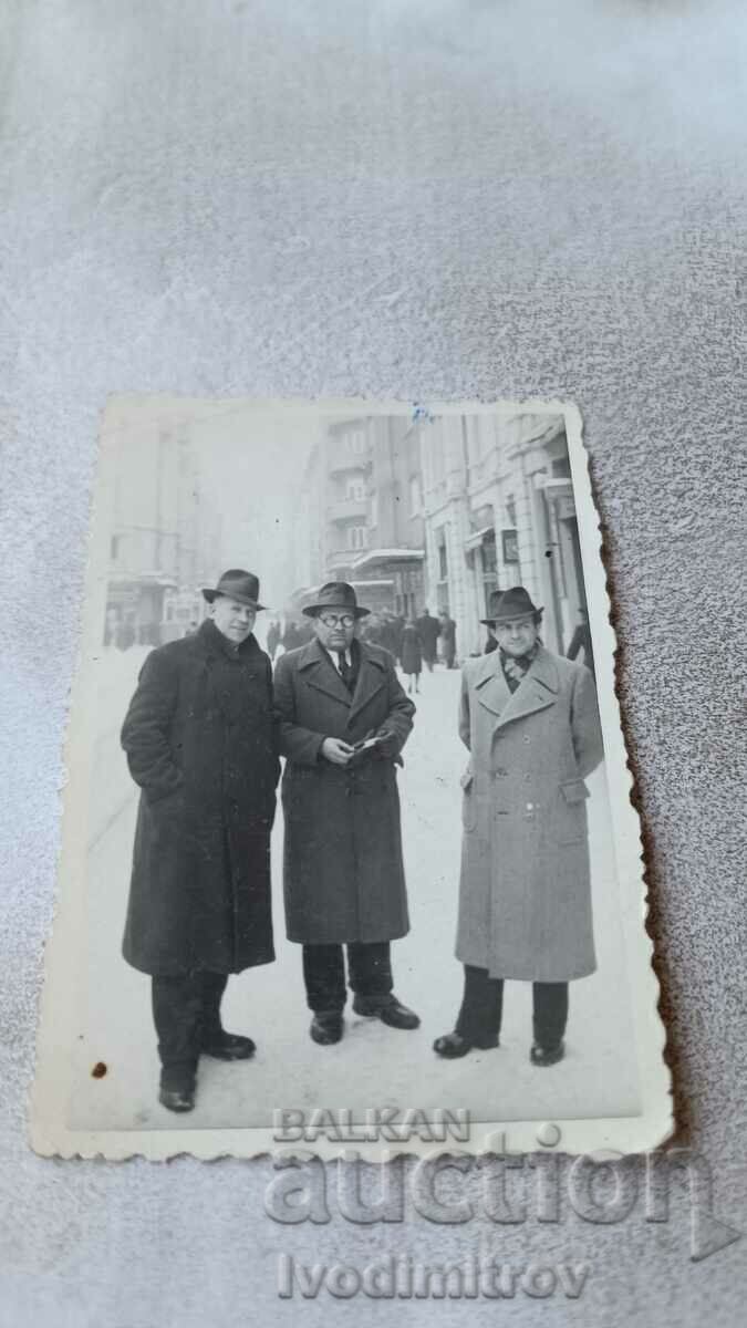 Photo Sofia Three men in winter coats on Slaveykov Square