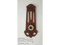 Old wooden barometer and thermometer