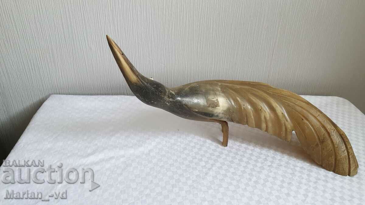 Old figure of a bird made of horn