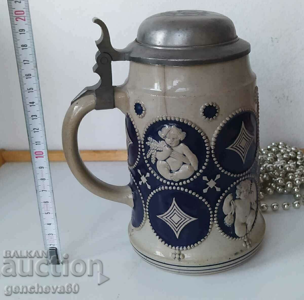 Collectible beer mug with initials, markings