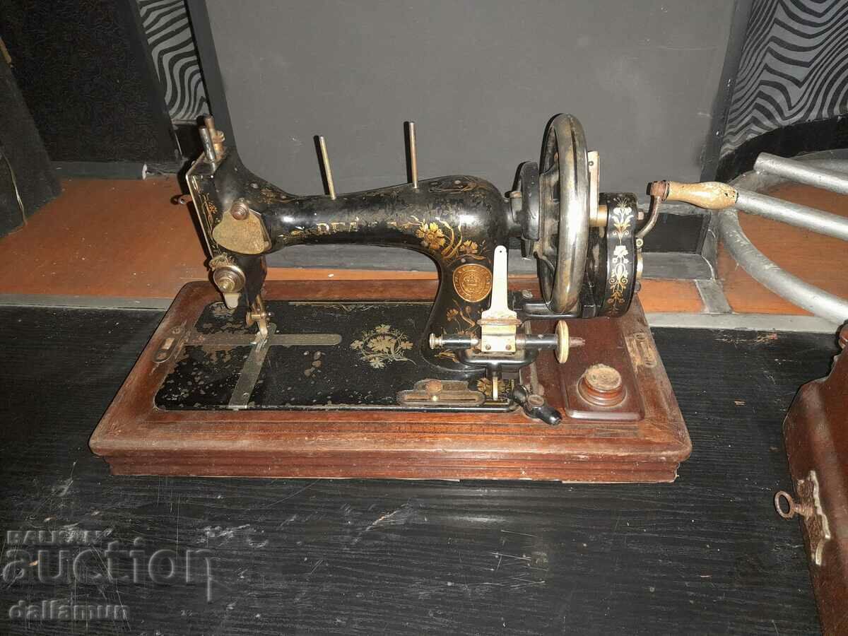 Old sewing machine in a wooden box