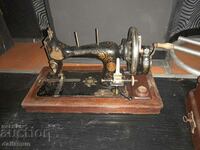 Old sewing machine in a wooden box