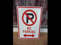 Metal sign inscription Prohibited parking cars people