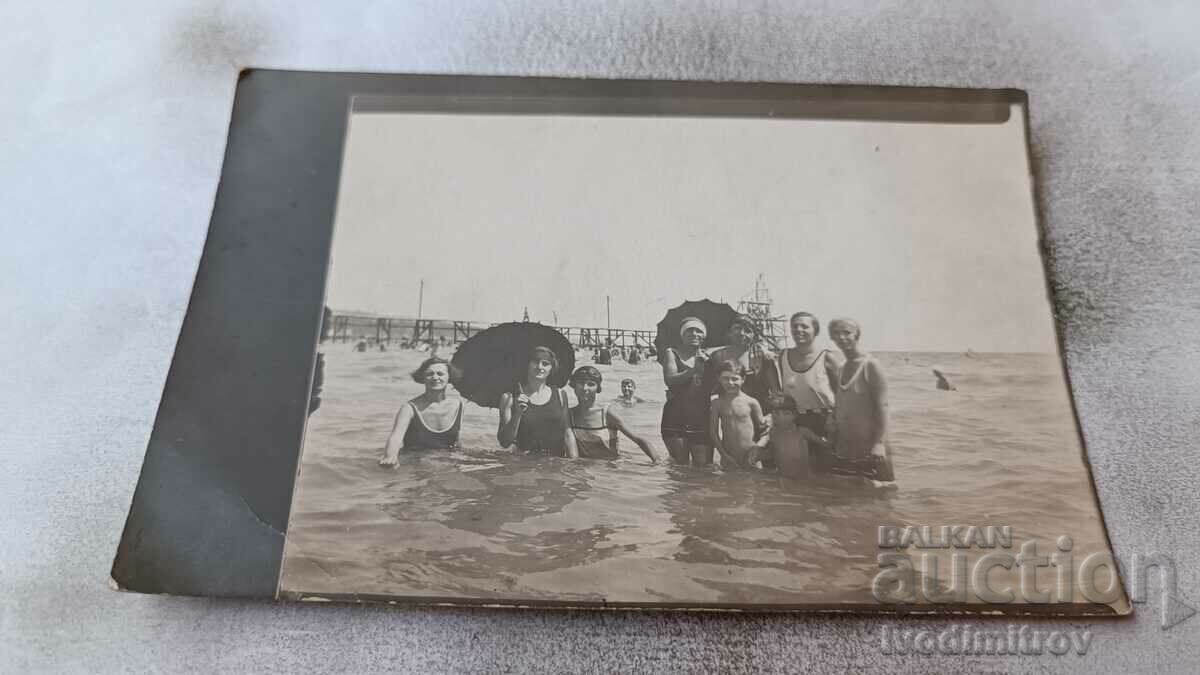 Photo Girls children in retro swimsuits in the sea