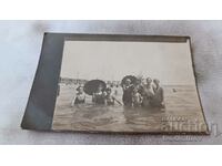 Photo Girls children in retro swimsuits in the sea