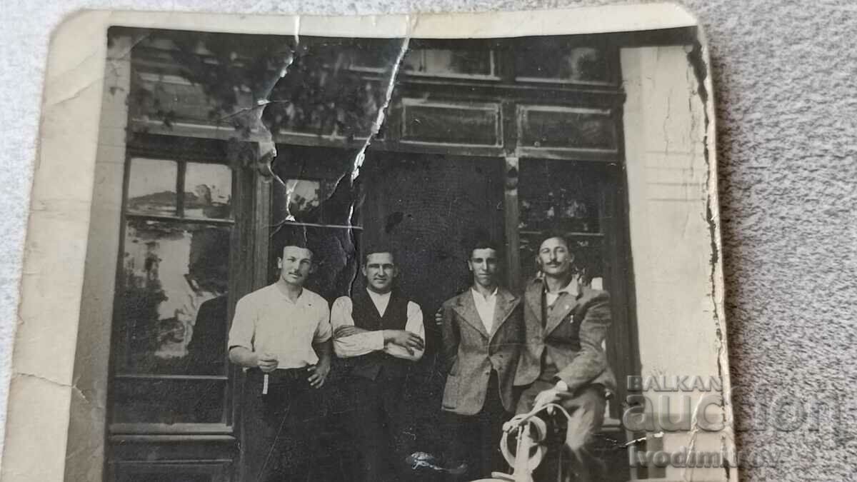 Photo Sofia Four men and a vintage bicycle in front of a shop with price 2.45 BGN | € 1.25 Photo Sofia Four men and a vintage bicycle in front of a shop with price 2.45 BGN | € 1.25