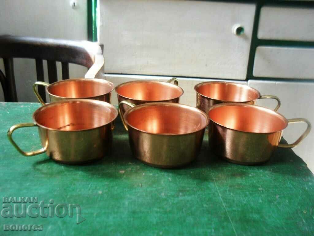 Set of copper mugs for coffee or tea
