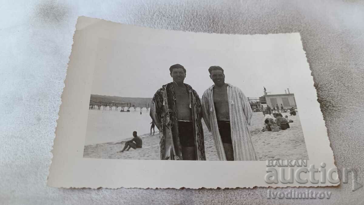 Photo Two men on the beach
