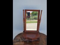A beautiful wooden dressing table with a mirror!