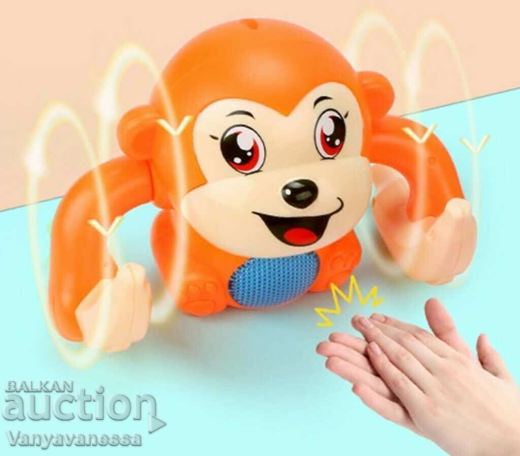 Baby toy rolling monkey, with clap