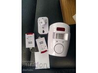 Alarm with motion sensor + 2 remotes, New!