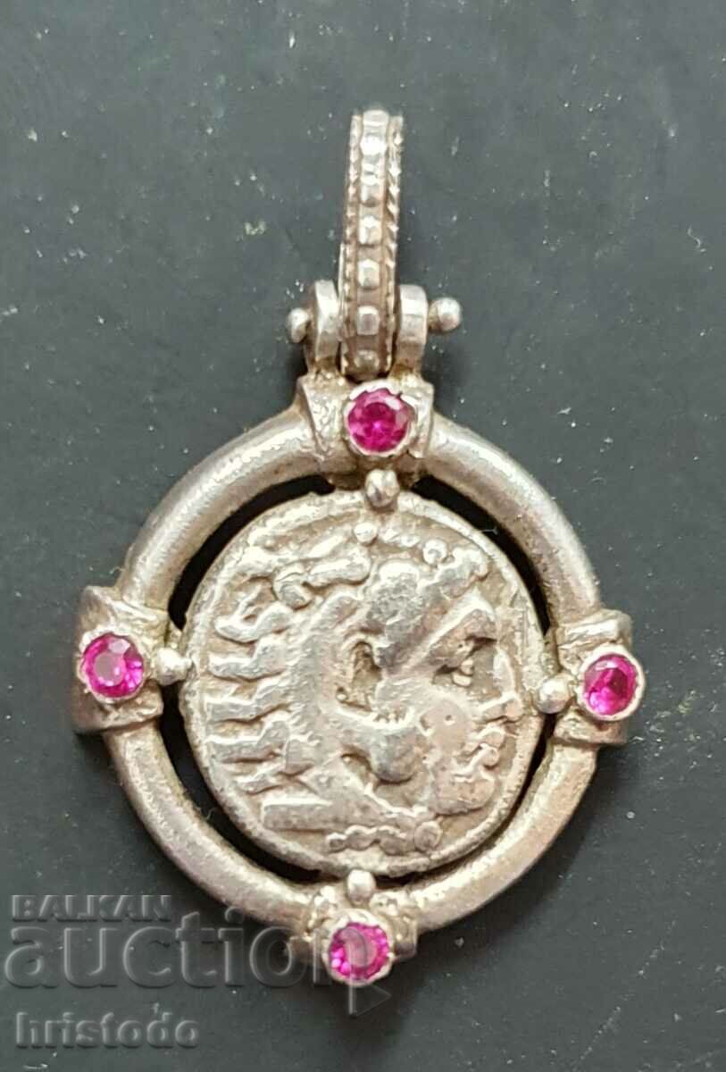 Silver locket with coin