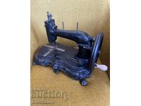 Sewing machine with metal base
