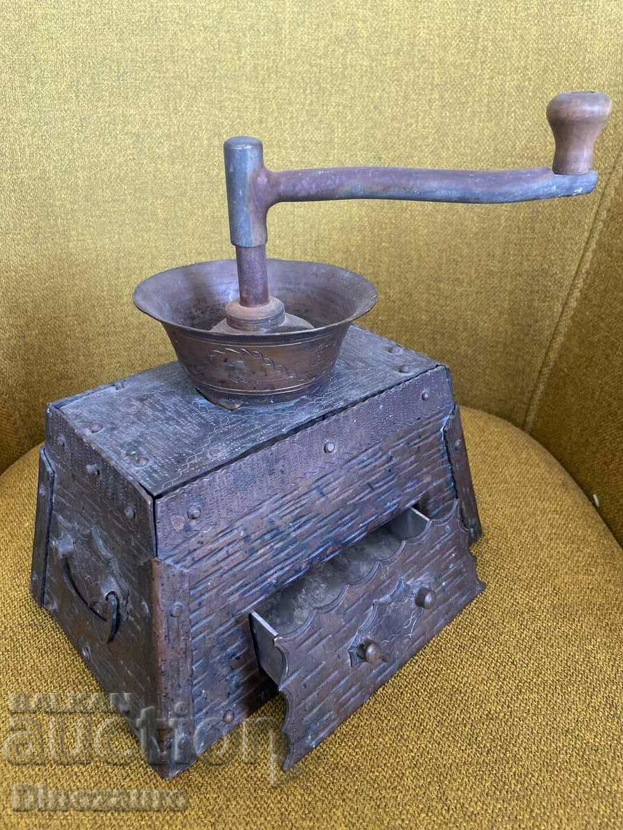 Antique coffee grinder with copper fittings