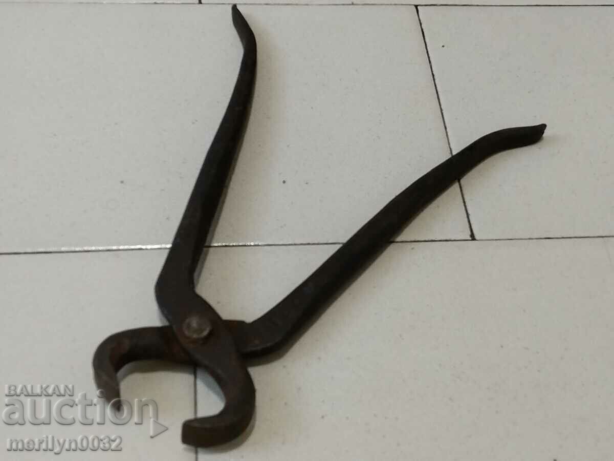 Old blacksmith's tongs, shingles, wrought iron