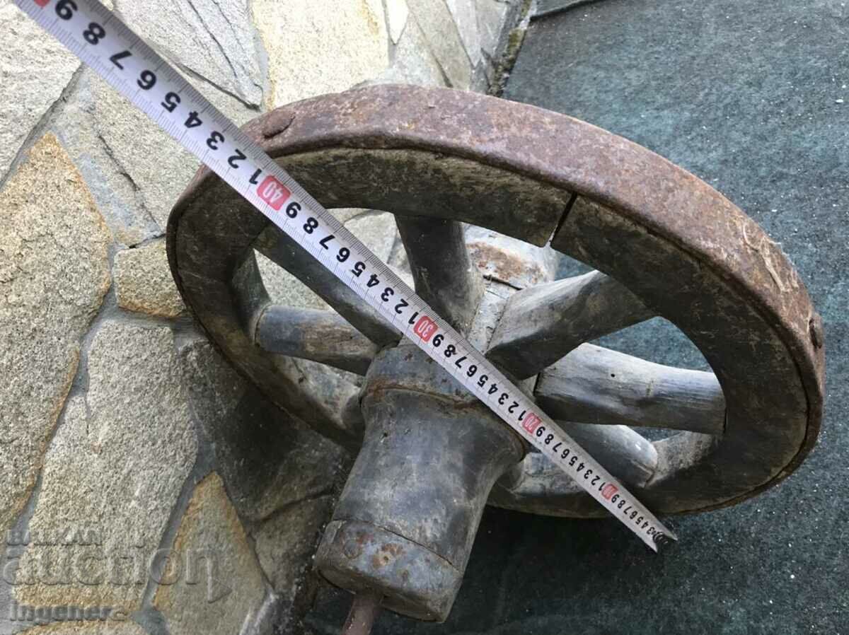 Auction WHEEL OF AN OLD WOOD AND WROUGHT IRON WHEEL Auction WHEEL OF AN OLD WOOD AND WROUGHT IRON WHEEL