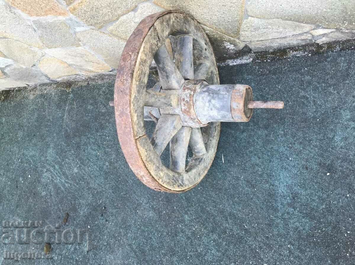 WHEEL OF AN OLD WOOD AND WROUGHT IRON WHEEL - 7 WHEEL OF AN OLD WOOD AND WROUGHT IRON WHEEL - 7