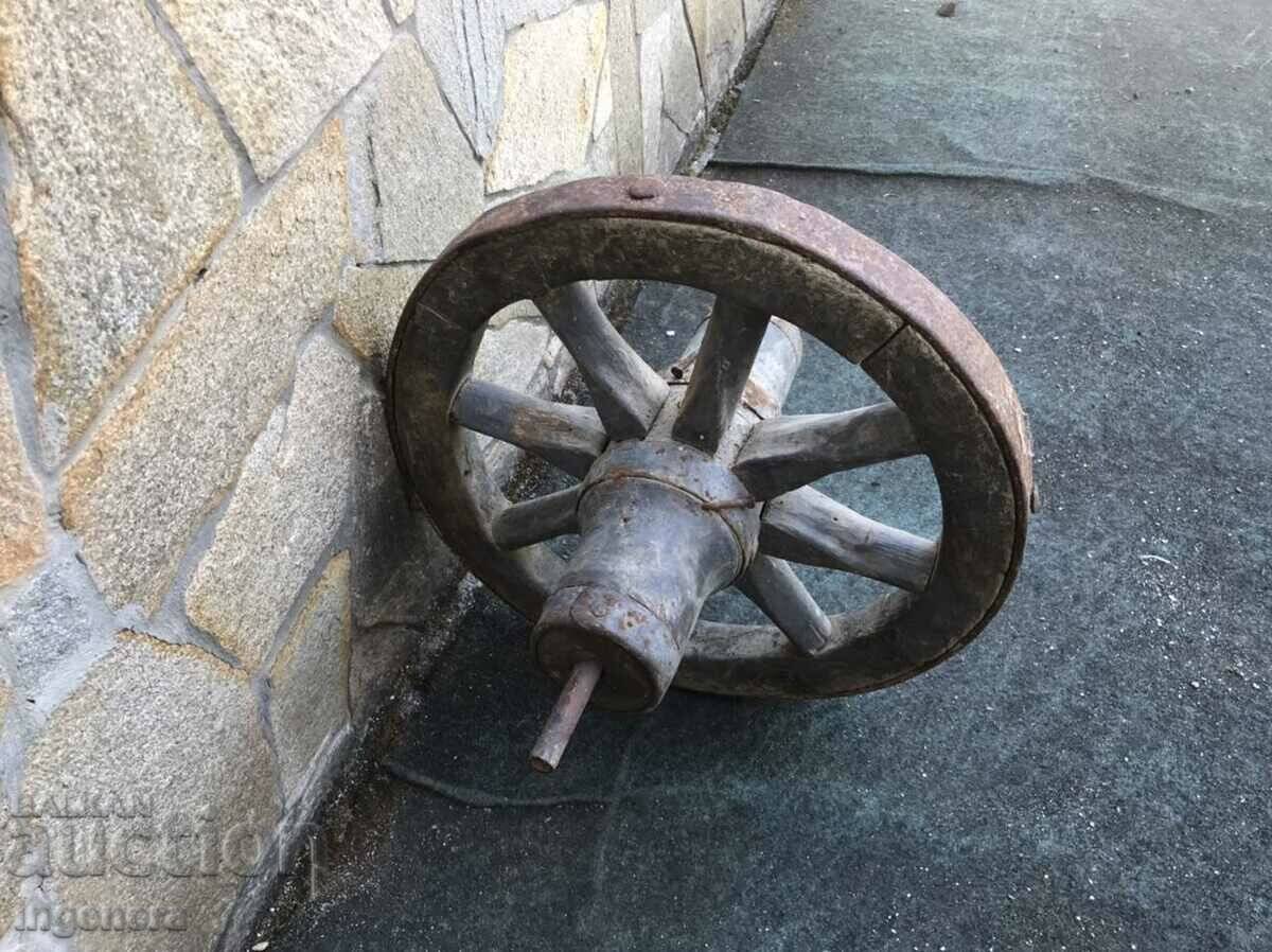 WHEEL OF AN OLD WOOD AND WROUGHT IRON WHEEL