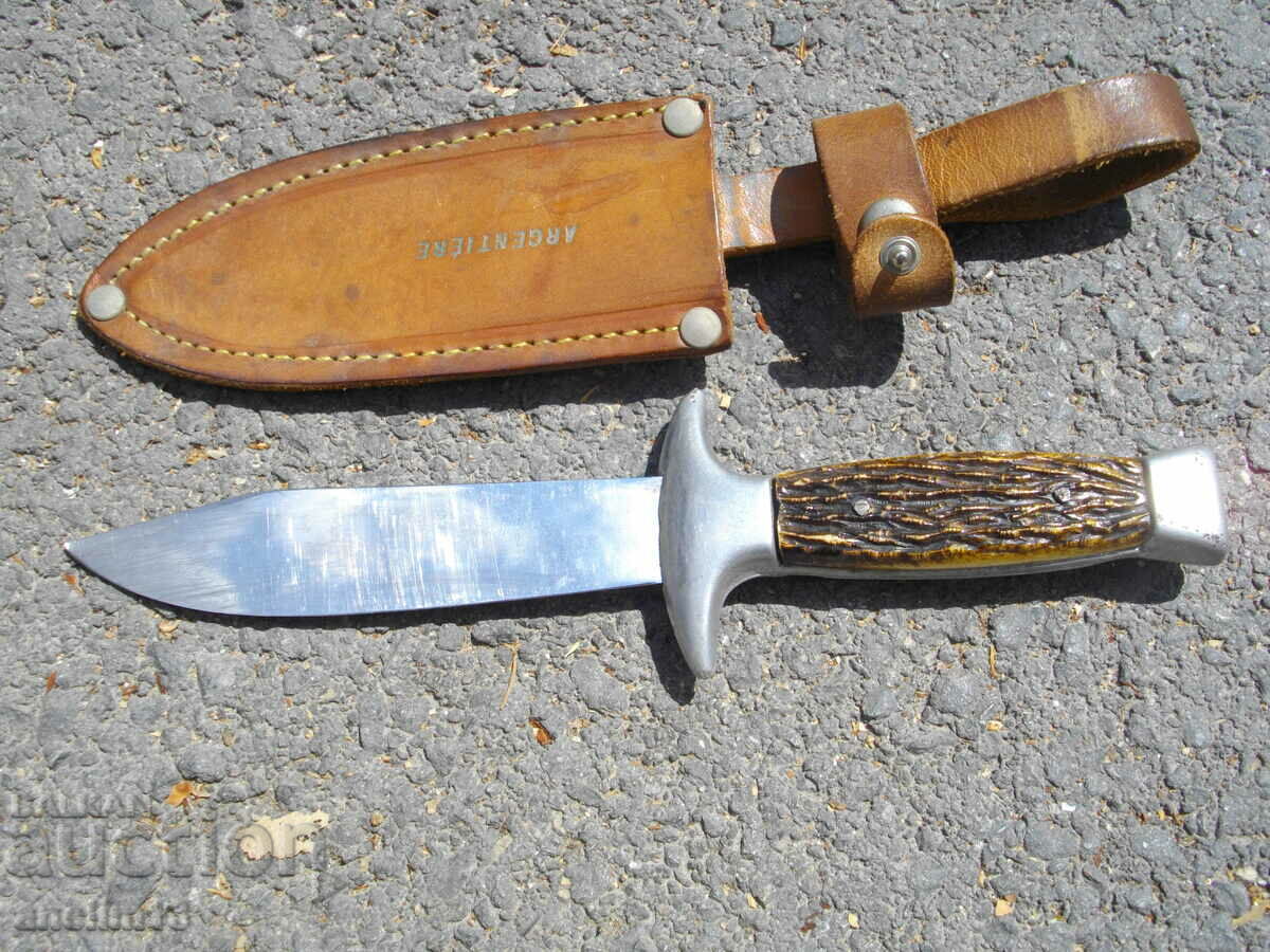 AN OLD KNIFE WITH A KNIFE