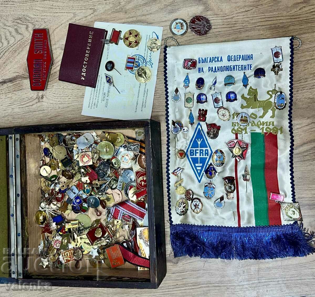 Military box with a large number of old enamel badges and medals