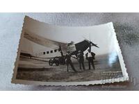 Photo Three men in front of one. aircraft D-2005 of LUFT HANSA