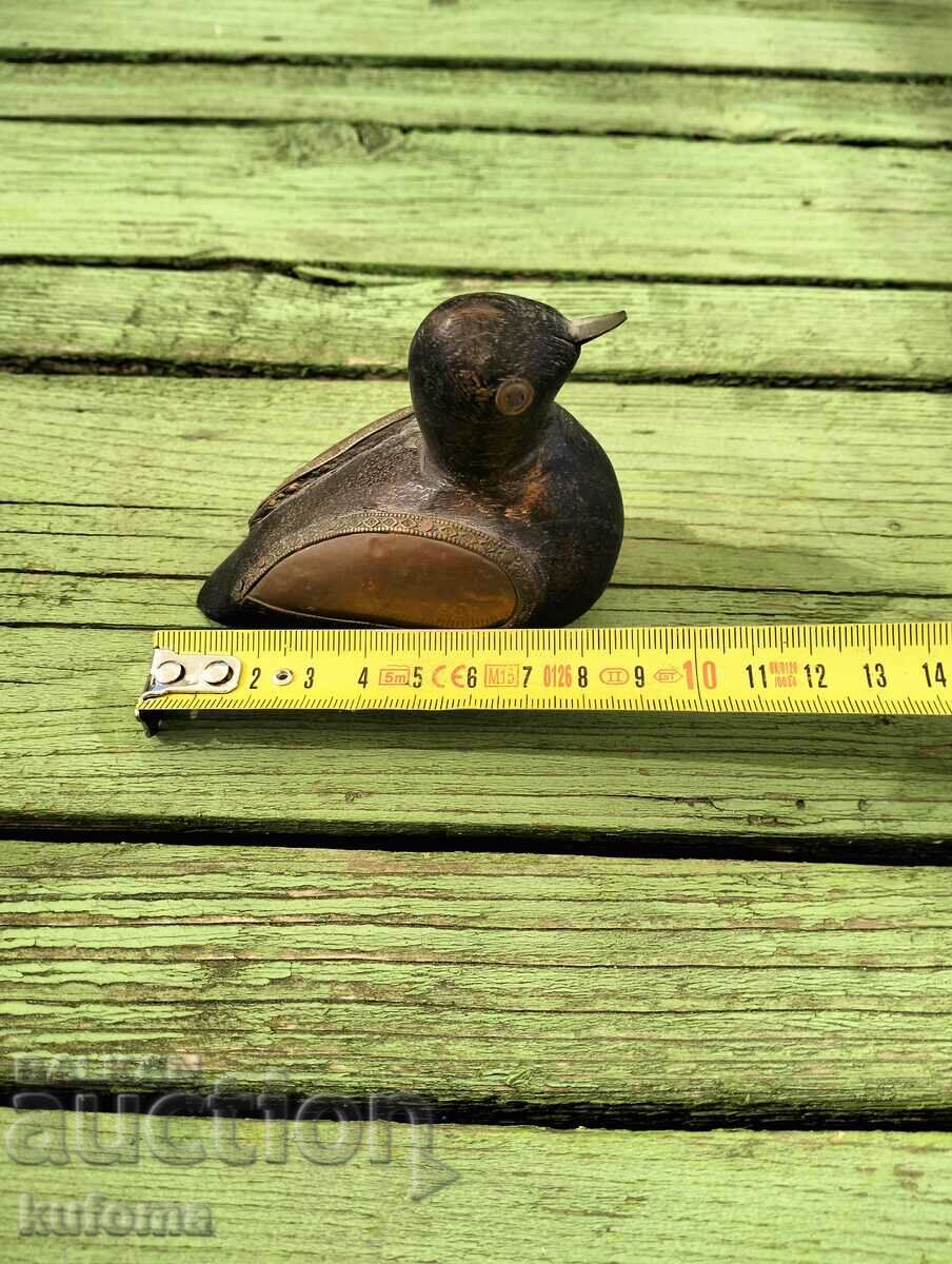 Auction  A little wood and copper duck