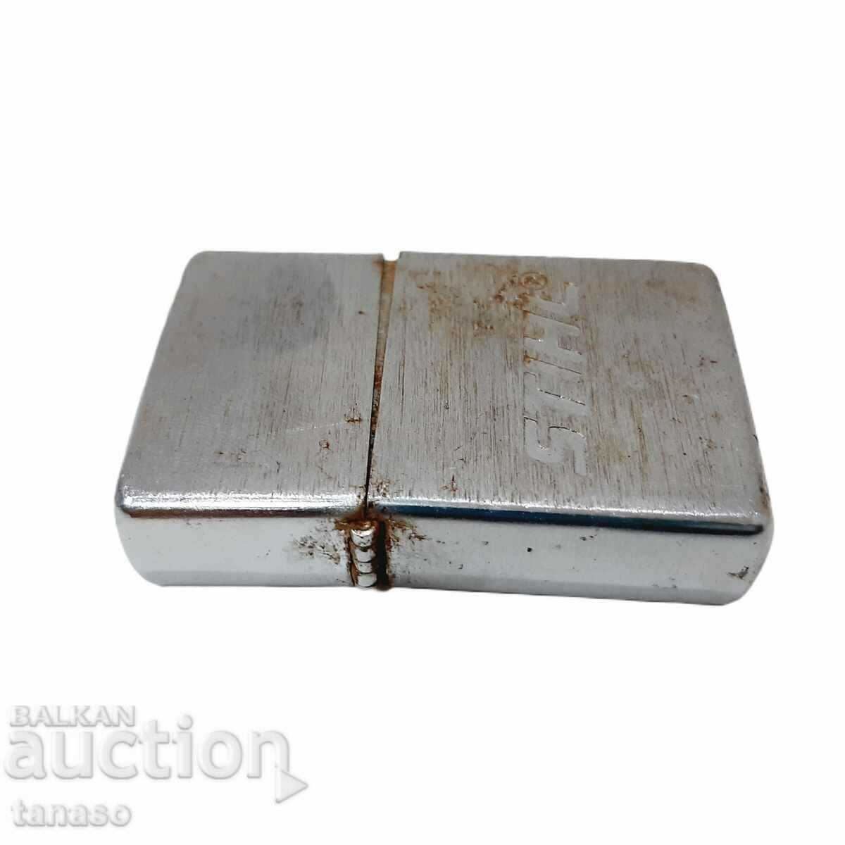 Livrarea Brichetă STIHL, model Zippo (2.3)