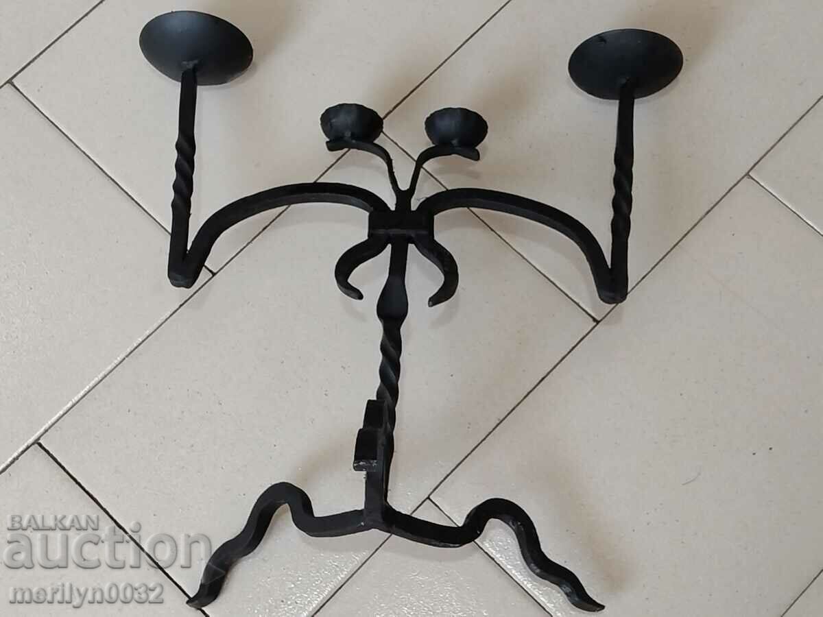 Delivery of Old wrought iron candlestick Delivery of Old wrought iron candlestick