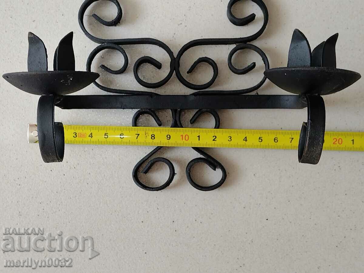 Delivery of Old wrought iron candlestick Delivery of Old wrought iron candlestick