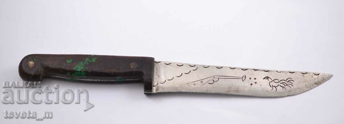 Antique knife with engraved blade