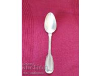 A solid silver spoon