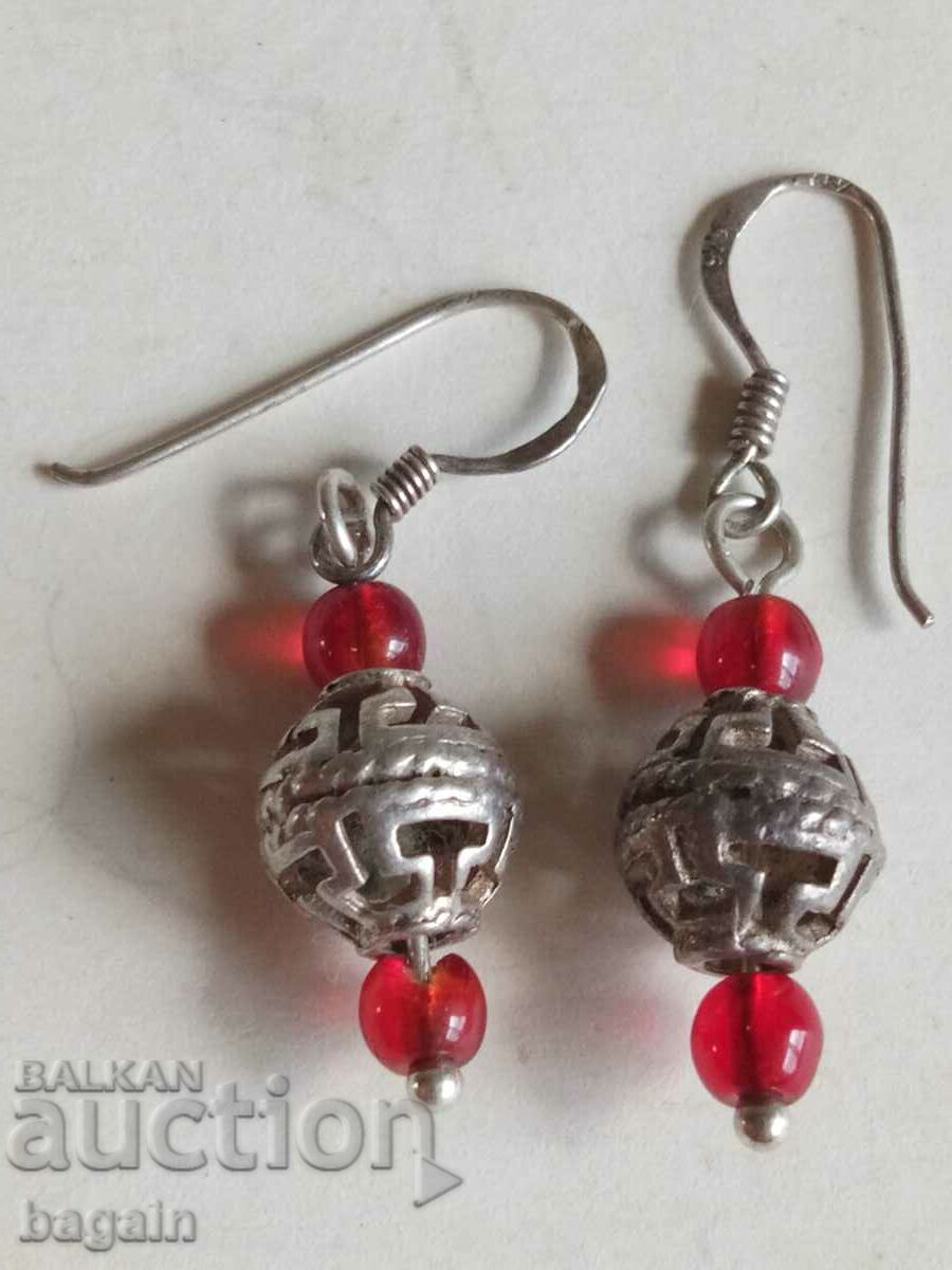 Silver earrings.
