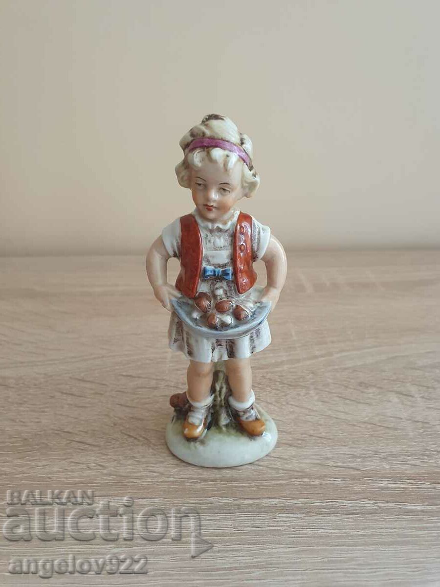 Old porcelain figurine figurine