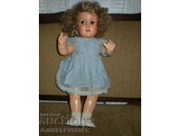 Old biscuit doll with open mouth and blinking eyes marked