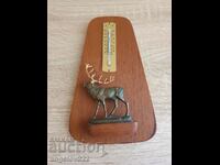 A thermometer with a bronze figure of a deer!