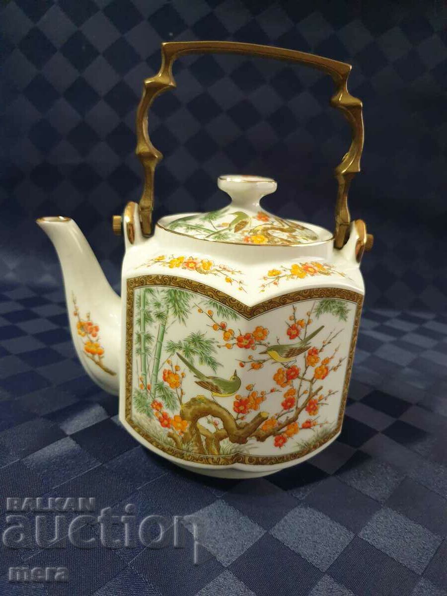 Porcelain teapot with bronze handle