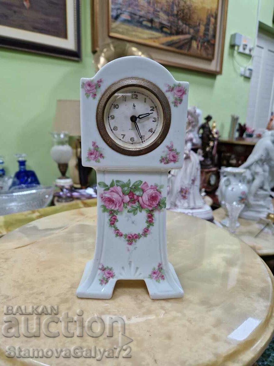A beautiful antique porcelain mechanical clock
