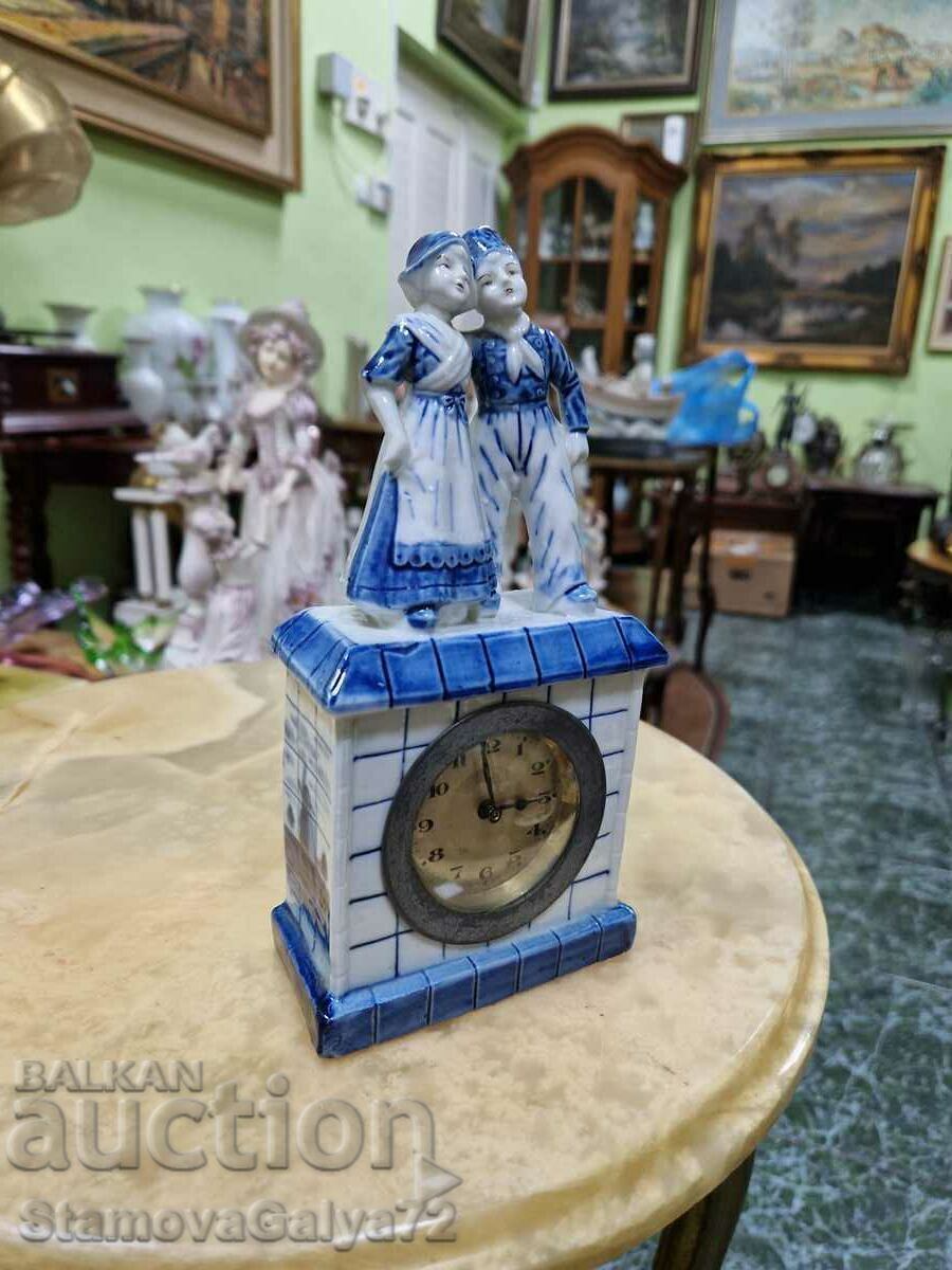 Delivery of Collectible Dutch porcelain table mechanical clock