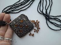 Old necklace with beads, filigree