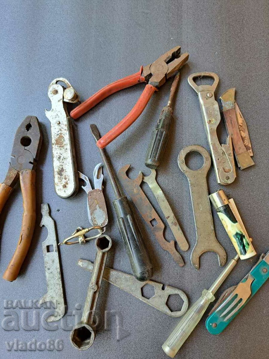 Lot of old pliers, screwdrivers, openers, etc.